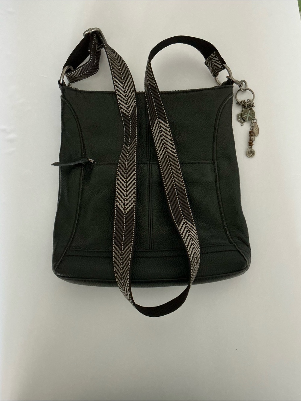 The Sak Black Leather Crossbody with Patterned Strap and Charm